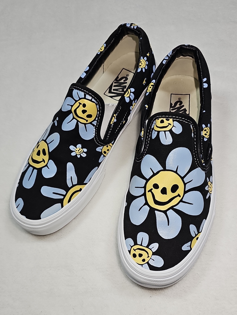Vans Black Slip-On with Blue Petal & Yellow Smiley Daisy Print